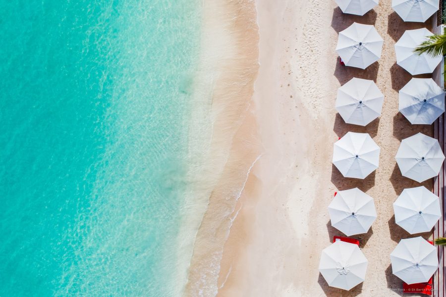Aerial shot of parasols, sea and the sandy St Jean beach at Eden Rock St Barts